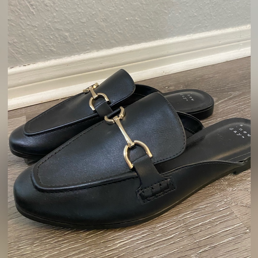 Black Leather Slip-On Loafers with Gold Accents